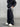 BLACK PUFFER JACKET AND TRACK PANTS OUTFIT WITH CHIC CARGO PARACHUTE DETAILS