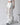HIGH-WAISTED WHITE JEANS WITH LACE DETAILING AND DISTRESSED RIPS