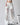 HIGH-WAISTED WHITE JEANS WITH LACE DETAILING AND DISTRESSED RIPS