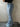 LIGHT BLUE FLARED JEANS WITH TRIBAL DESIGN AND SKINNY FIT BELT