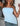 LIGHT BLUE STRAPLESS TOP WITH PLAYFUL SLANTED HEM