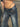 LOW-RISE FLARED JEANS WITH CHAIN DETAIL AND WIDE TROUSER LEGS