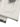 WASHED WHITE JEANS WITH DARK GRAY SPLOTCHES AND BLACK STAINS WASHED