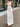 WHITE HALTER VEST AND MAXI SKIRT SET WITH CUTE SPLIT SKIRT DESIGN