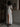 WHITE MAXI DRESS WITH THIGH-HIGH SLIT AND PUFF SLEEVE DETAILS