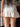 WHITE RUFFLED MINI SKIRT WITH ADJUSTABLE CRISSCROSS TIE, SLIM FIT