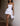 WHITE STRAPLESS MINI DRESS WITH FLORAL DETAIL AND DARING BACKLESS DESIGN - Sweetheart Supplies