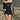 BLACK OFF-SHOULDER MINI DRESS WITH WHITE LACE AND RIBBON ACCENTS