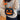 BLACK PUMPKIN-SHAPED PURSE WITH ORANGE ACCENTS FOR HALLOWEEN