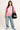 CASUAL WOMEN'S OUTFIT WITH PINK JERSEY AND JEANS