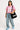 CASUAL WOMEN'S OUTFIT WITH PINK JERSEY AND JEANS