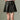 CHIC PLEATED MINI SKIRT IN BLACK FAUX LEATHER