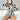 COW PRINT ROMPER: PLUSH COW PRINT LONG ADULT ONESIE