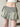 GREEN DENIM PLEATED MINI SKIRT