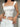 LACE-TRIMMED CORSET TOP AND SKIRT SET WITH DEEP NECKLINE
