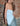 LIGHT BLUE STRAPLESS TOP WITH PLAYFUL SLANTED HEM