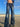 LOW-RISE FLARED JEANS WITH CHAIN DETAIL AND WIDE TROUSER LEGS