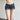 LOW-RISE SLIM-FIT DISTRESSED DENIM SHORTS WITH SLIGHT STRETCH IN SOLID COLOR