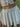 WHITE LAYERED MINI SKIRT WITH IRREGULAR HEM